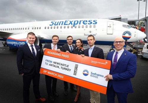 Newcastle Airport and SunExpress staff next to aircraft